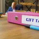 Financial concept about GIFT TAX with inscription on the File Folder.