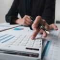 financial inspector hands making report, calculating or checking balance